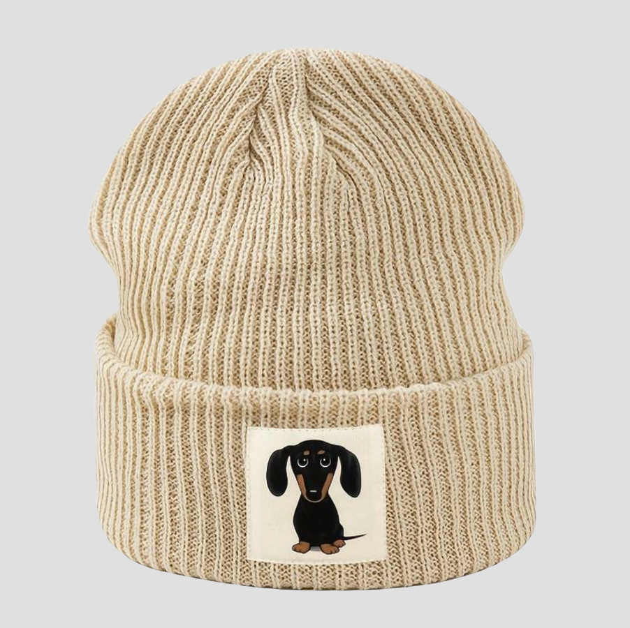 Beige knitted hat with cartoon dachshund patch