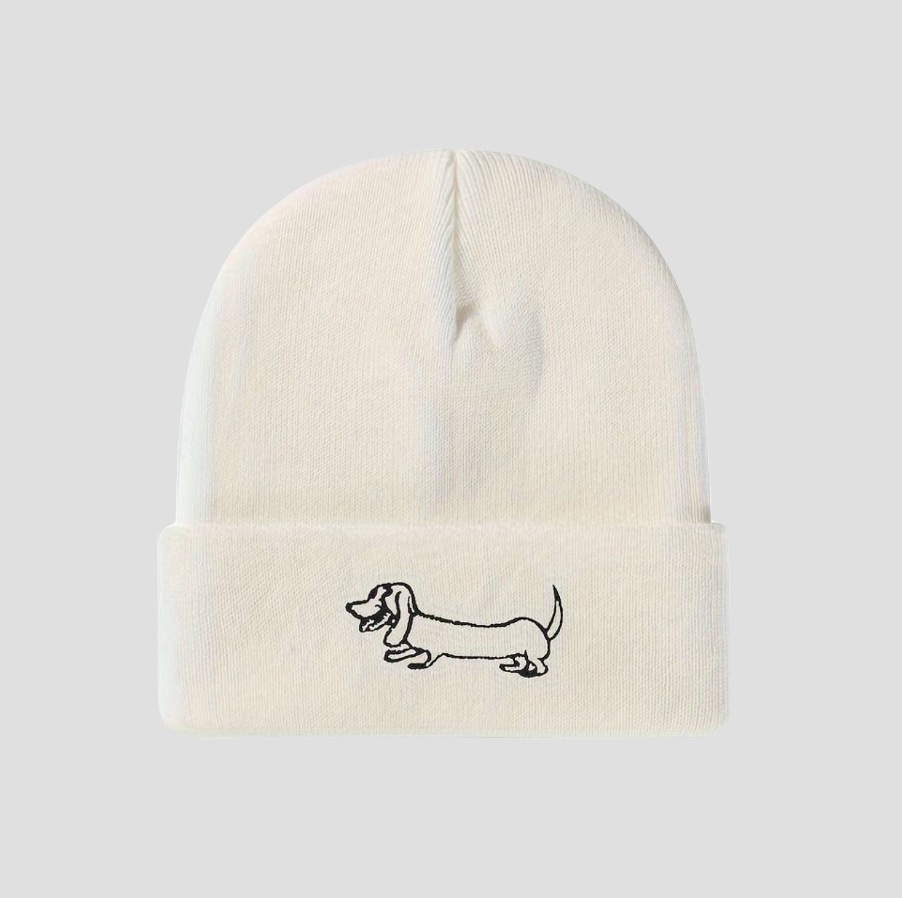 White knitted hat with dachshund embroidery