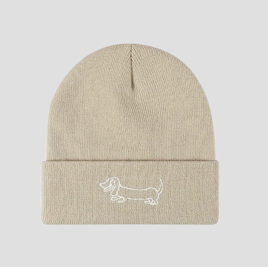 Beige knitted hat with dachshund embroidery