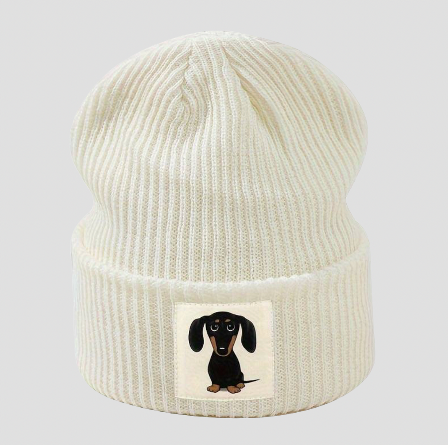 White knitted hat with cartoon dachshund patch